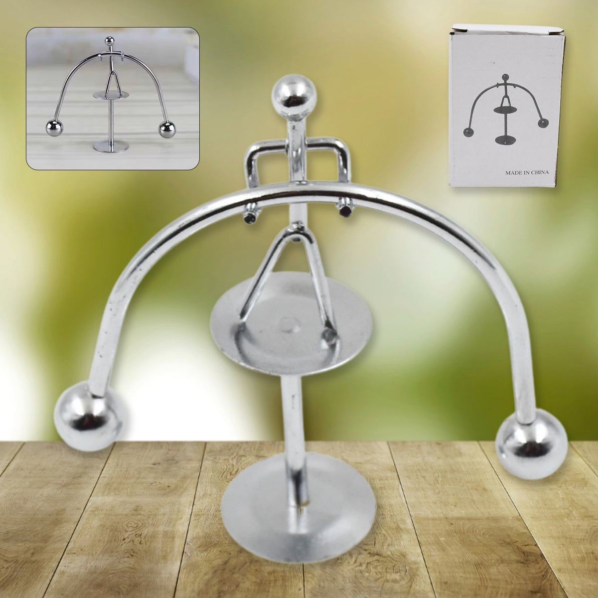 A silver metal balance toy with a small inset image of the toy and a white box with a diagram. – view 7