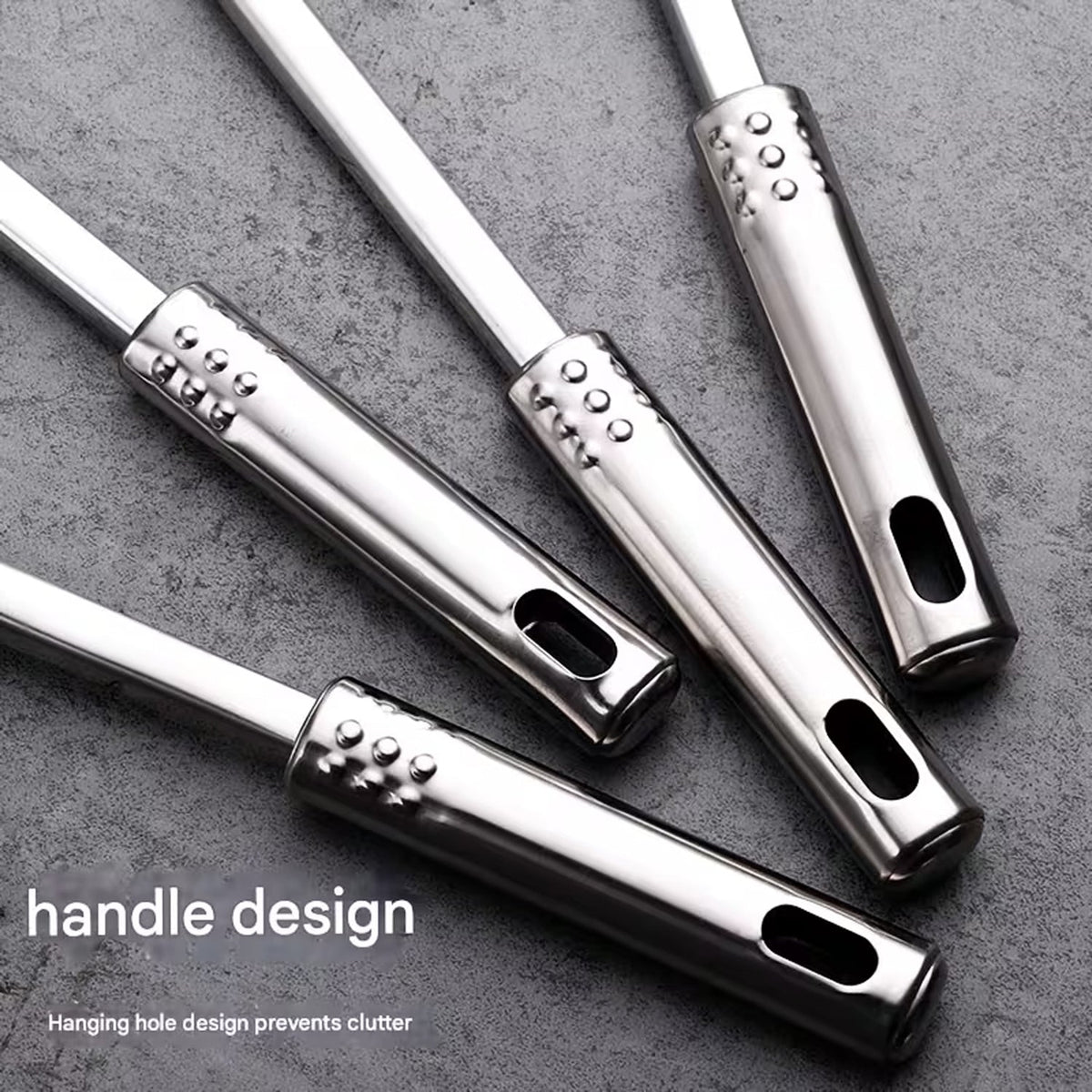 Close up of hanging holes on stainless steel kitchen utensil handles