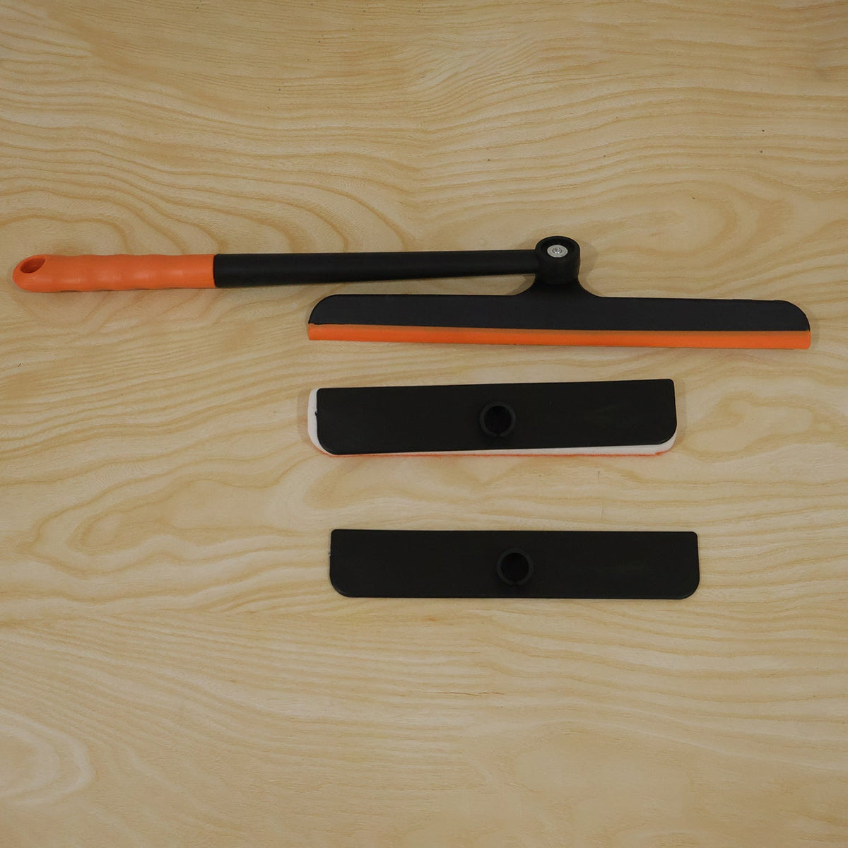 Another live product photo showing the orange and black window squeegee