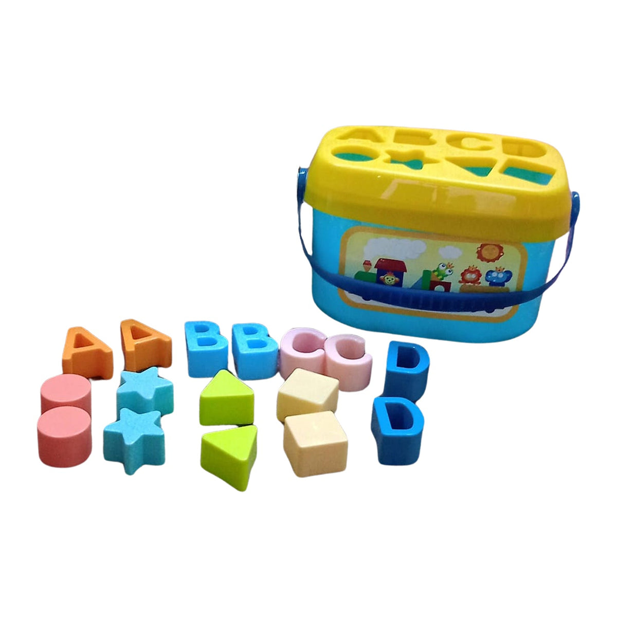 A blue and yellow shape sorter bucket with a handle sits next to an assortment of colorful alphabet and geometric blocks on