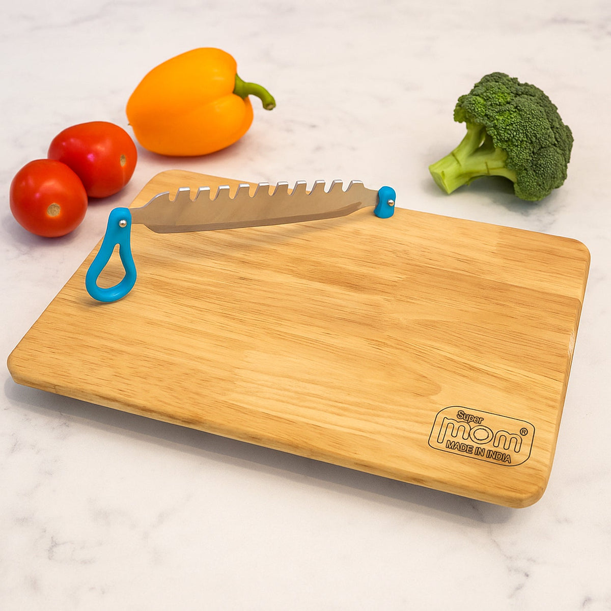 Wooden cutting board with a blue safety knife, featuring the 'Super Mom' logo and 'Made in India' text.