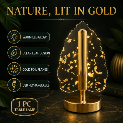 A golden crystal leaf LED table lamp on a dark surface with text highlighting its features like warm glow and USB