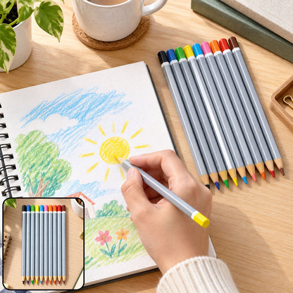 A hand holds a yellow-tipped gray pencil, coloring a sun on a sketchpad, with the other nine pencils lying beside it on a