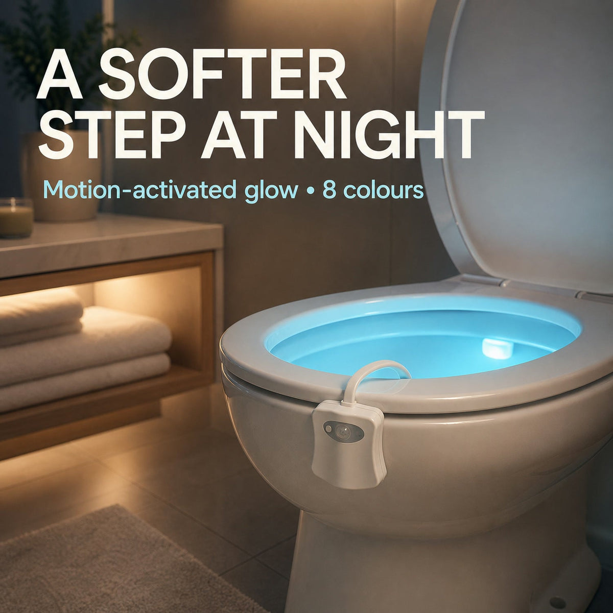 Toilet with a blue glowing bowl from the motion sensor light, in a softly lit bathroom setting with towels.