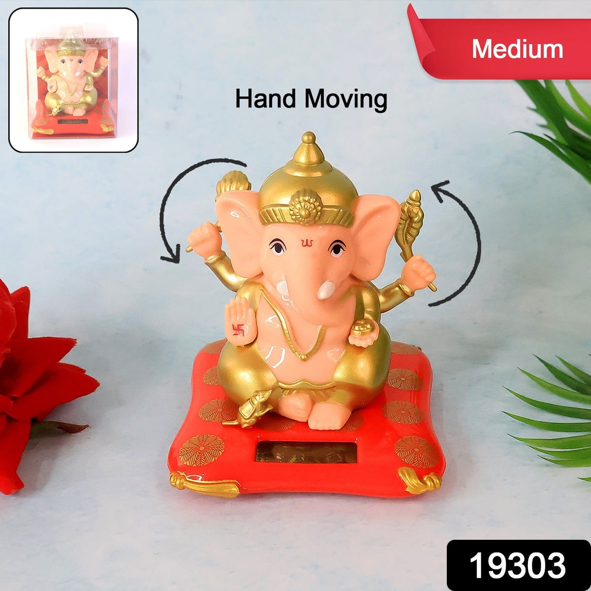 A Ganesha idol on a red base with arrows indicating its hands move, next to a red flower and green leaf.