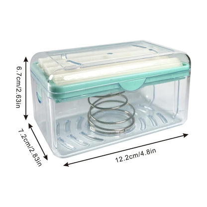 A clear soap dispenser with mint green accents and white rollers, displaying its dimensions in centimeters and inches.