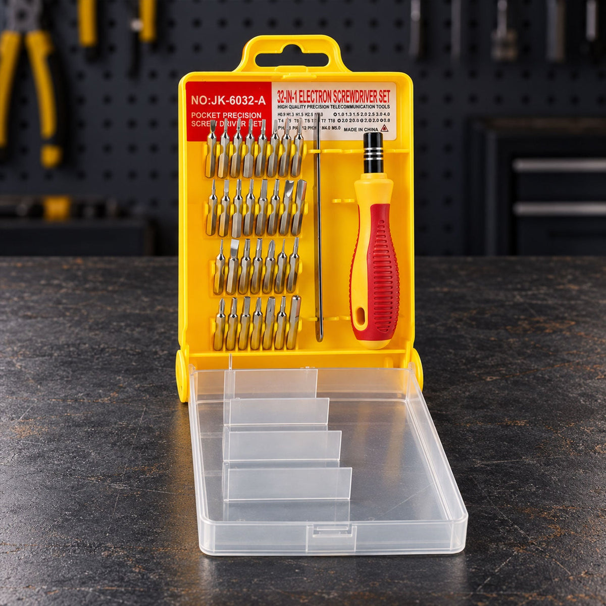 A 32-in-1 precision screwdriver set in a yellow case with a clear lid, displayed on a dark textured surface.