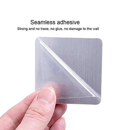 A hand holds a square metallic adhesive pad with a clear protective film, labeled seamless adhesive.