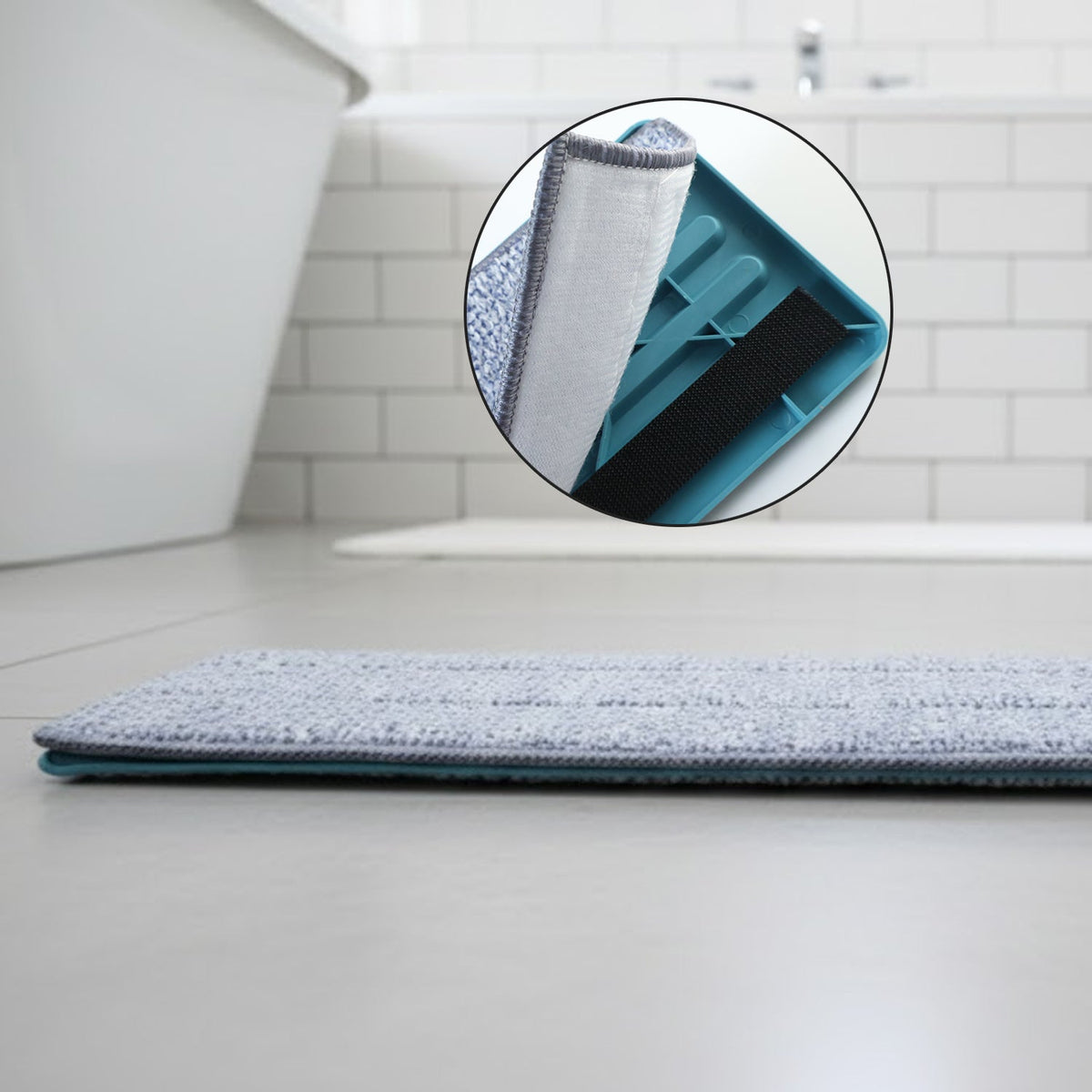 A close-up of the grey microfiber mop head on a bathroom floor, with a circular inset showing the mop head's underside.