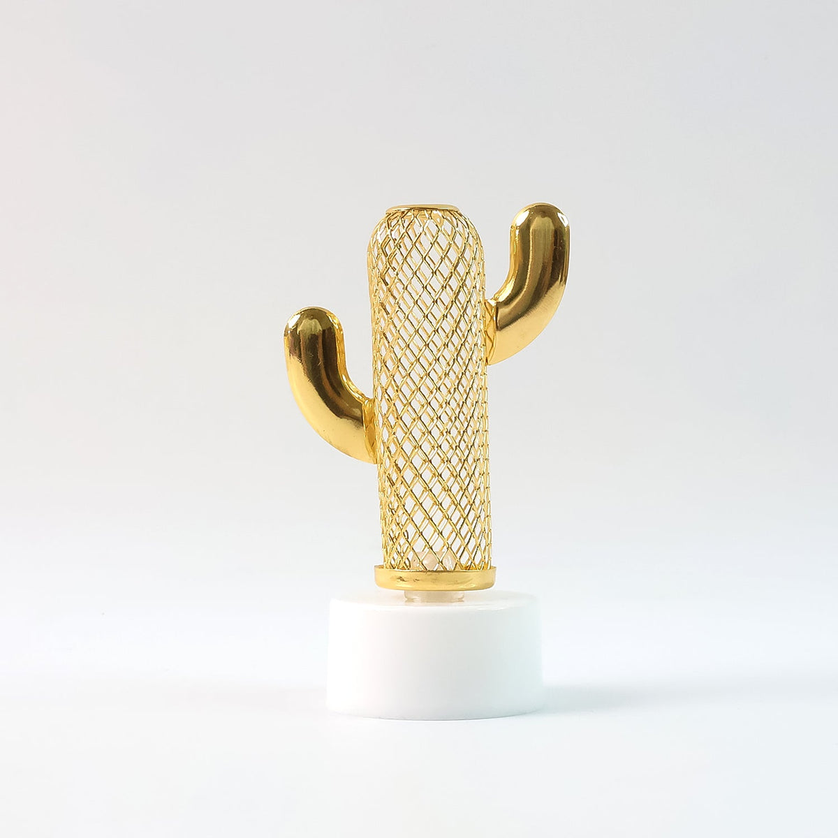 A single gold mesh cactus-shaped light with a white base stands upright against a plain white background.
