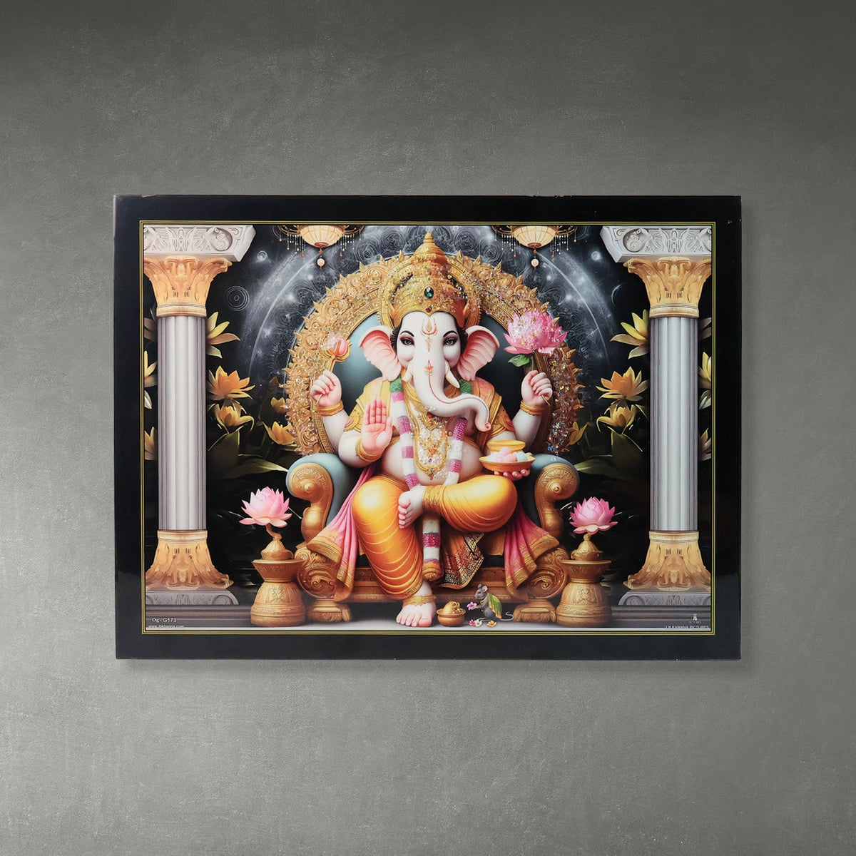 Lord Ganesha painting in a black frame, seated on a throne between two ornate pillars, with pink lotus flowers.