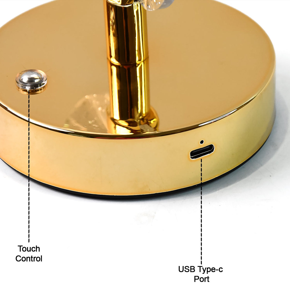 A close-up of the gold base of the lamp, highlighting the touch control button and USB Type-C port.