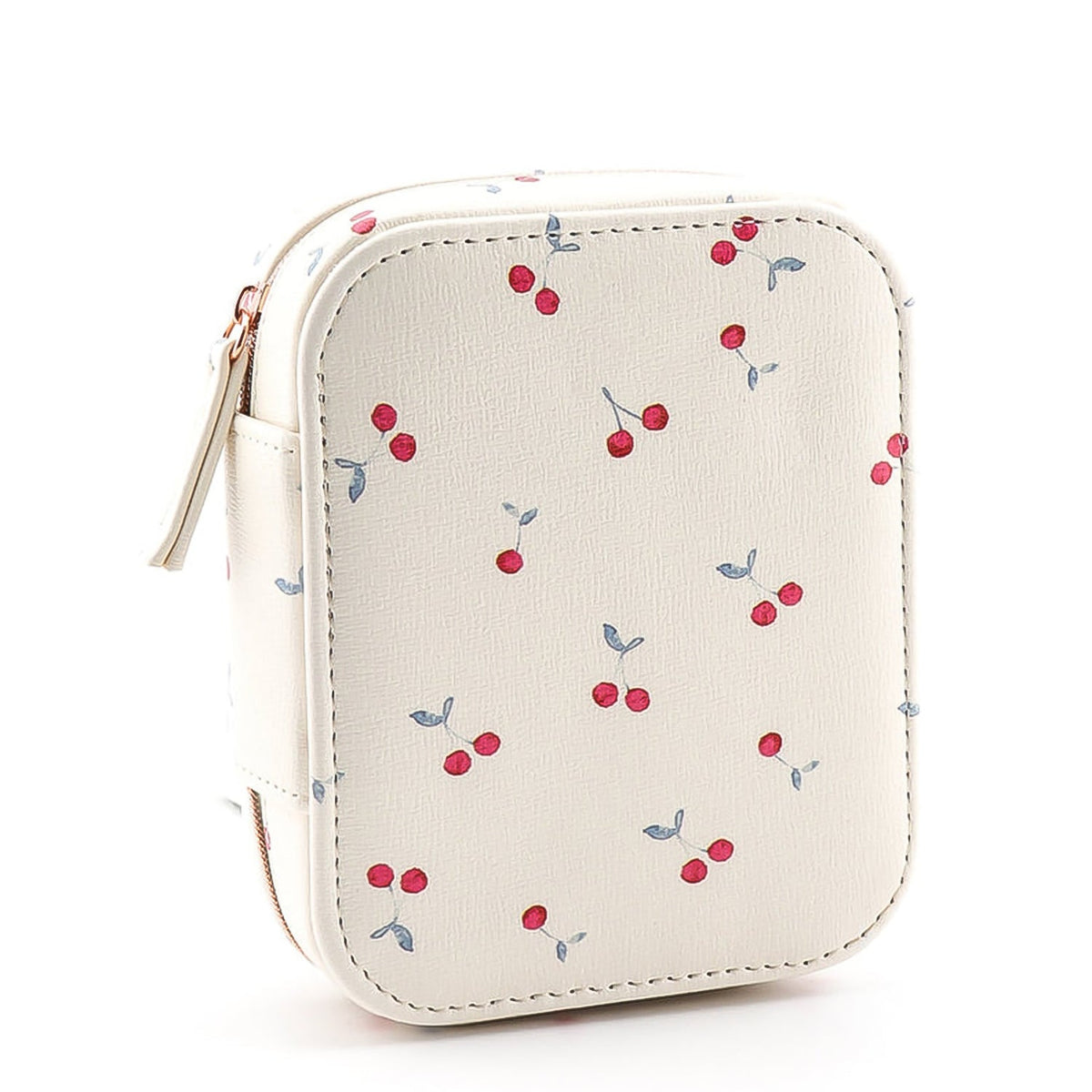 A closed cherry print jewelry organizer case with a zipper and small handle, standing upright on a white surface.