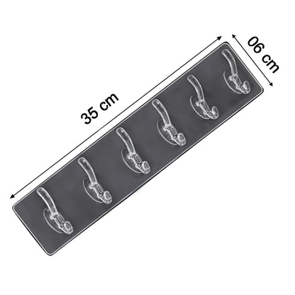 A clear plastic 6-hook adhesive wall rail is shown at an angle with dimensions of 35 cm by 6 cm.