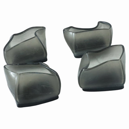 Four dark grey silicone furniture leg caps are arranged on a white background.