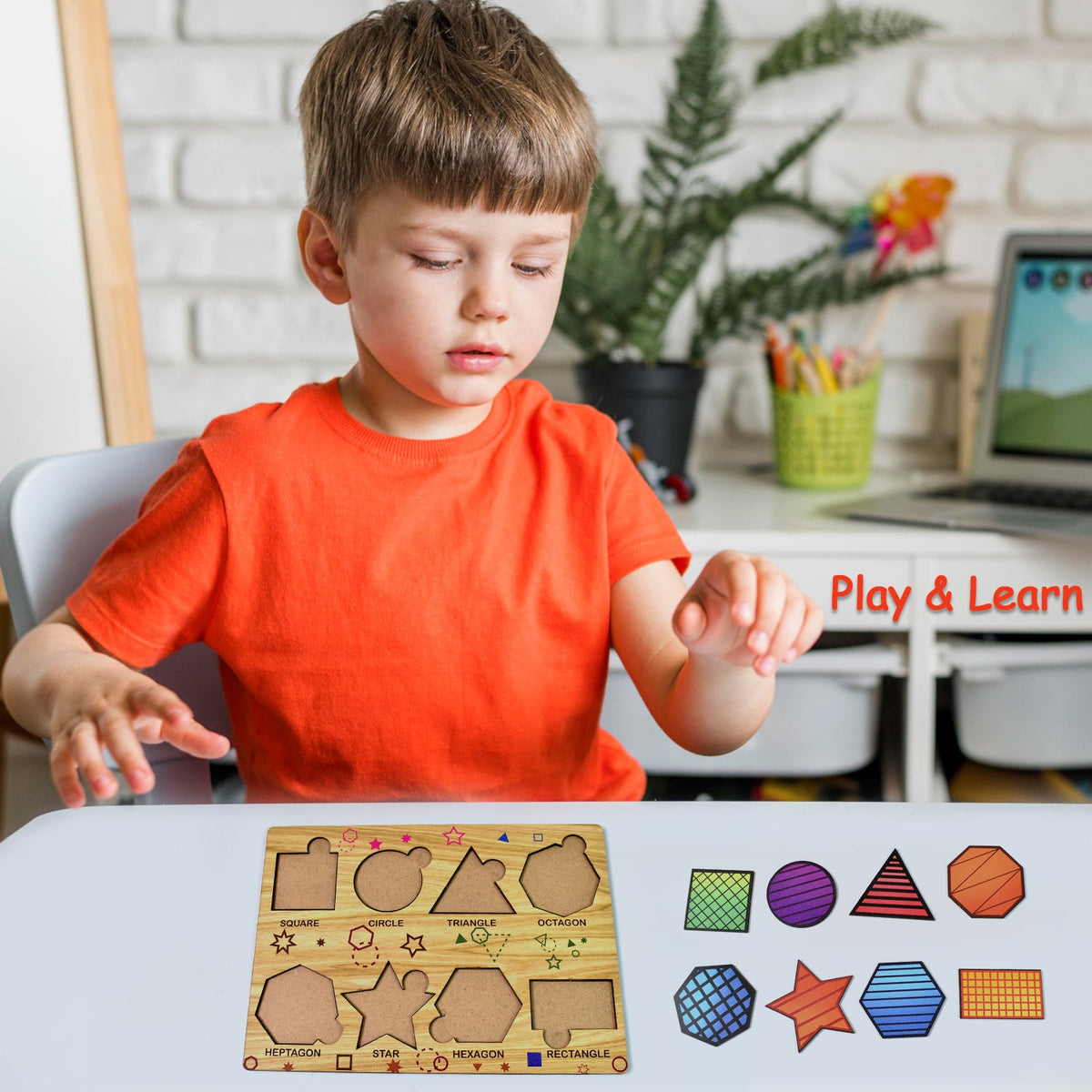 A young boy in an orange shirt sits at a table with the wooden shape sorting puzzle and its pieces.