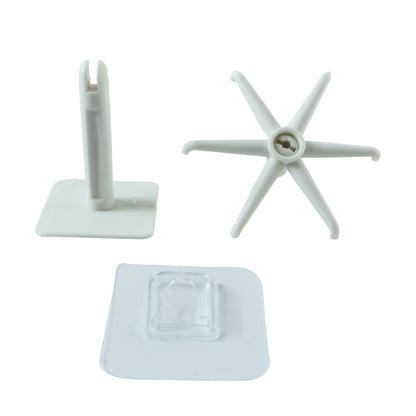 Three white plastic components of a rotating hook are arranged on a white background.