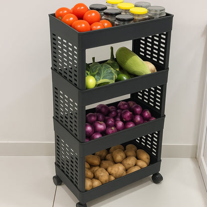 A black four-tier plastic utility trolley on wheels, filled with tomatoes, various vegetables, red onions, and potatoes.