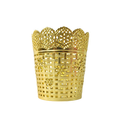 A gold plastic pen holder with a floral lace top rim and a woven basket-like body is centered on a white background.