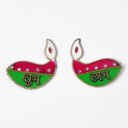 Two identical diya-shaped stickers, one with 'Shubh' and the other with 'Labh', on a plain white background.