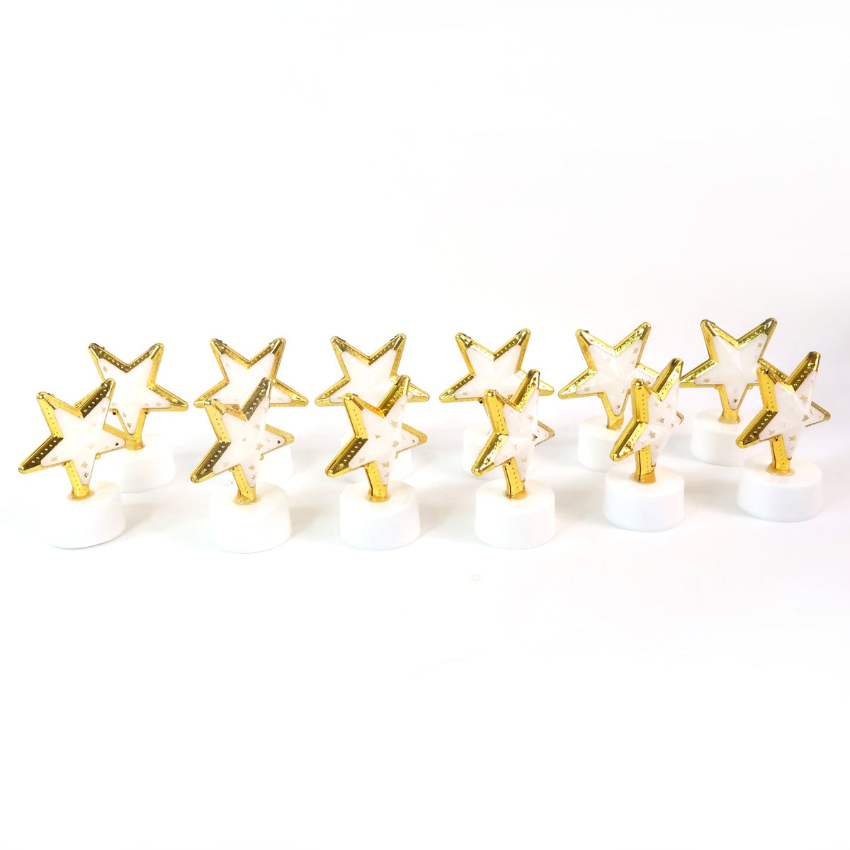 Twelve unlit star-shaped LED candles with gold frames and white bases lined up on a plain white background.