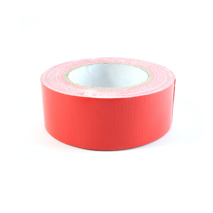 A single roll of red tape on a white background