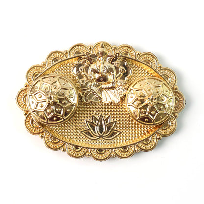A gold-finished chopra with an embossed Ganesh, two ornate round containers, and a lotus design on a plain white background.