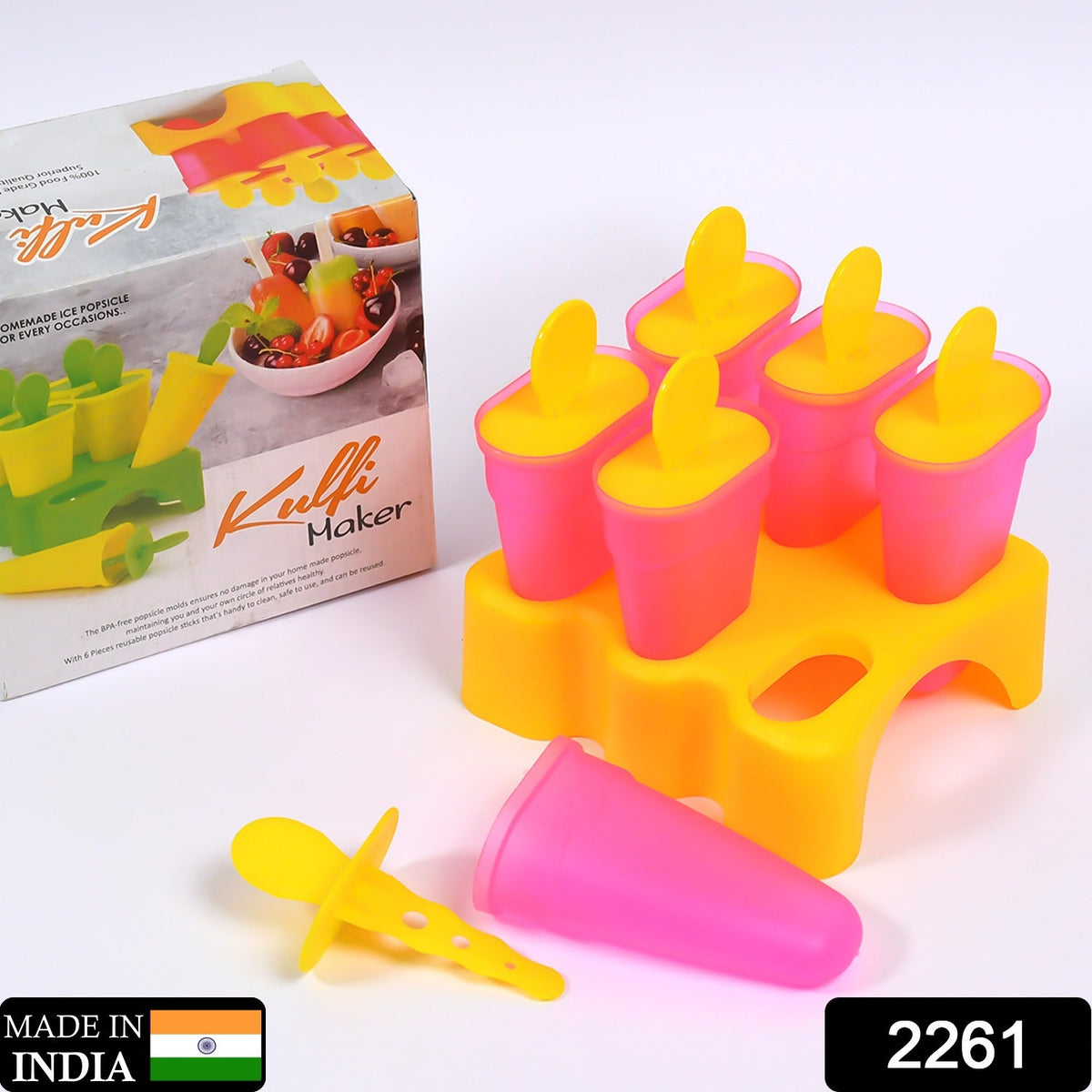 Six pink and yellow popsicle molds in a yellow stand, with one mold and stick removed, next to a product box.