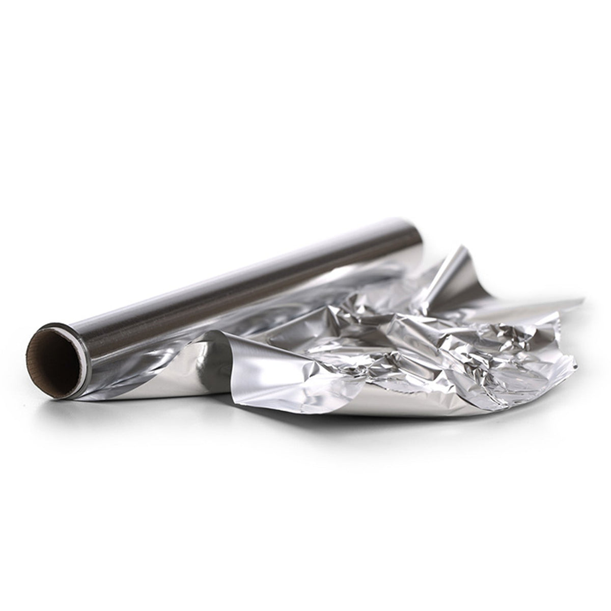 A partially unrolled silver aluminum foil roll with crumpled foil next to it on a white background.