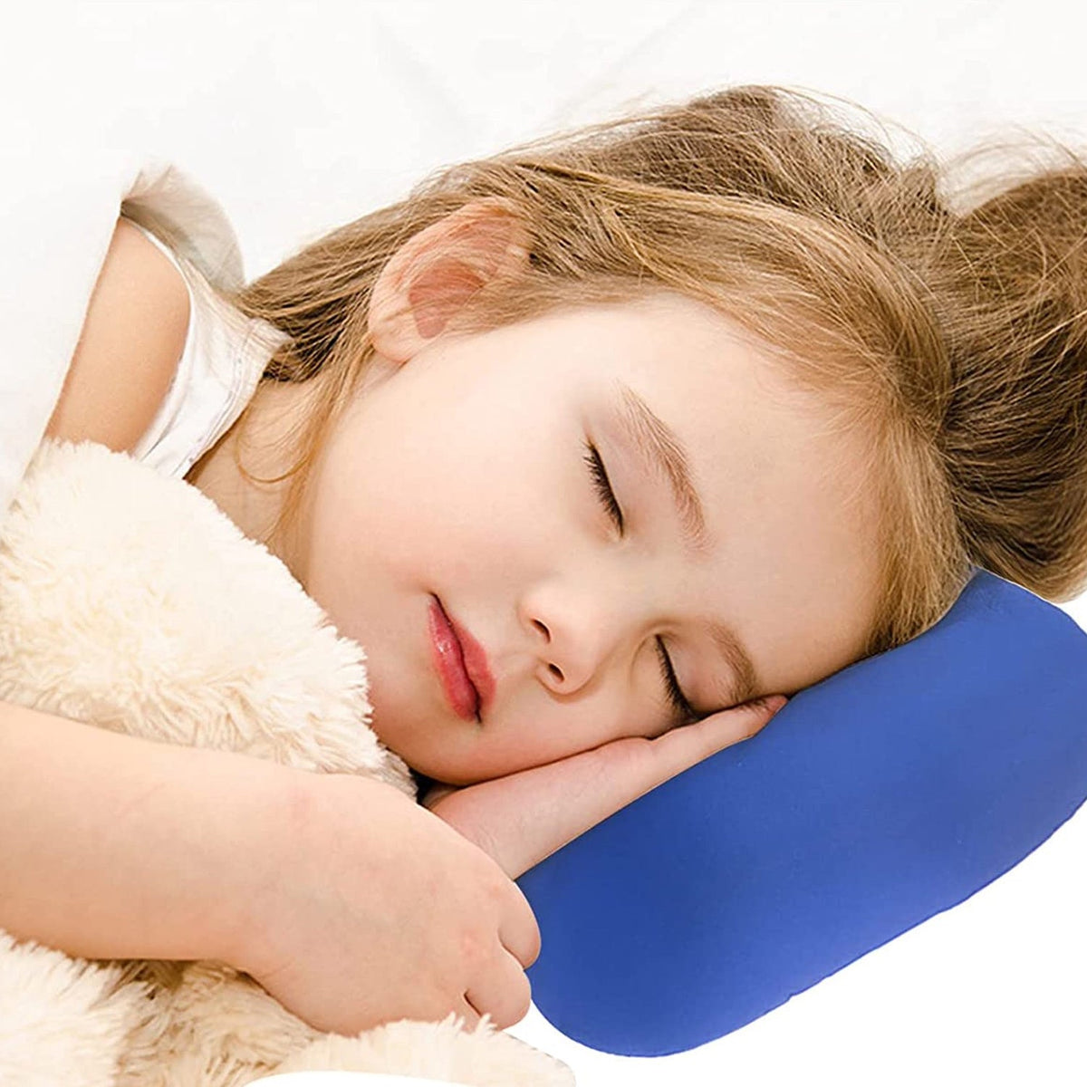 A dark gray bone-shaped microbead pillow is secured to a light gray textured car seat headrest.