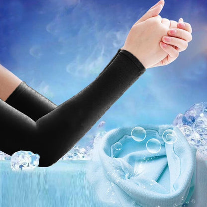Arms wearing black compression sleeves with ice cubes and water splashes, showing a light blue fabric interior.
