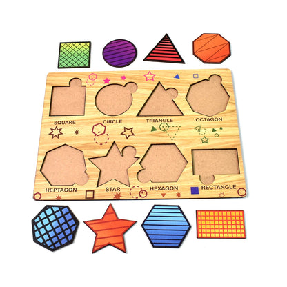 The wooden shape sorting puzzle board is empty, with all colorful geometric pieces arranged neatly below it on a white