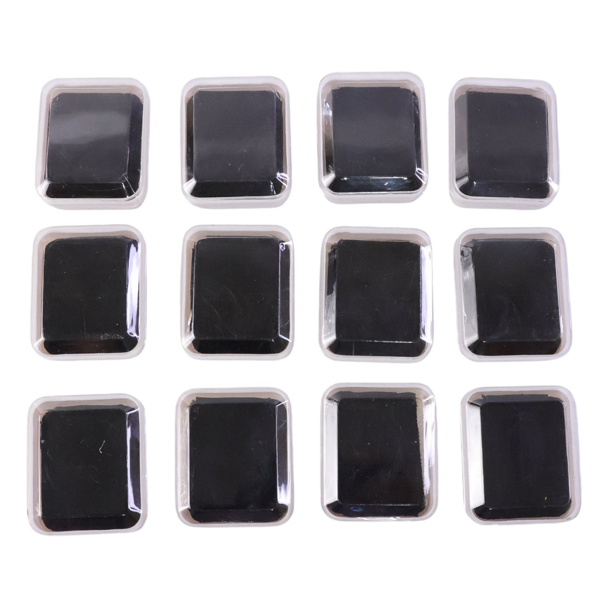 Twelve clear-lidded white jewellery boxes with black inserts arranged neatly on a plain white background.