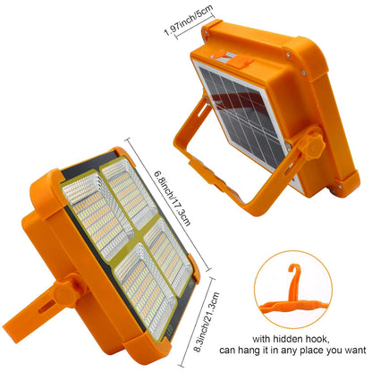 Orange and black solar LED flood light with dimensions and a hidden hook feature for hanging, displayed on a white