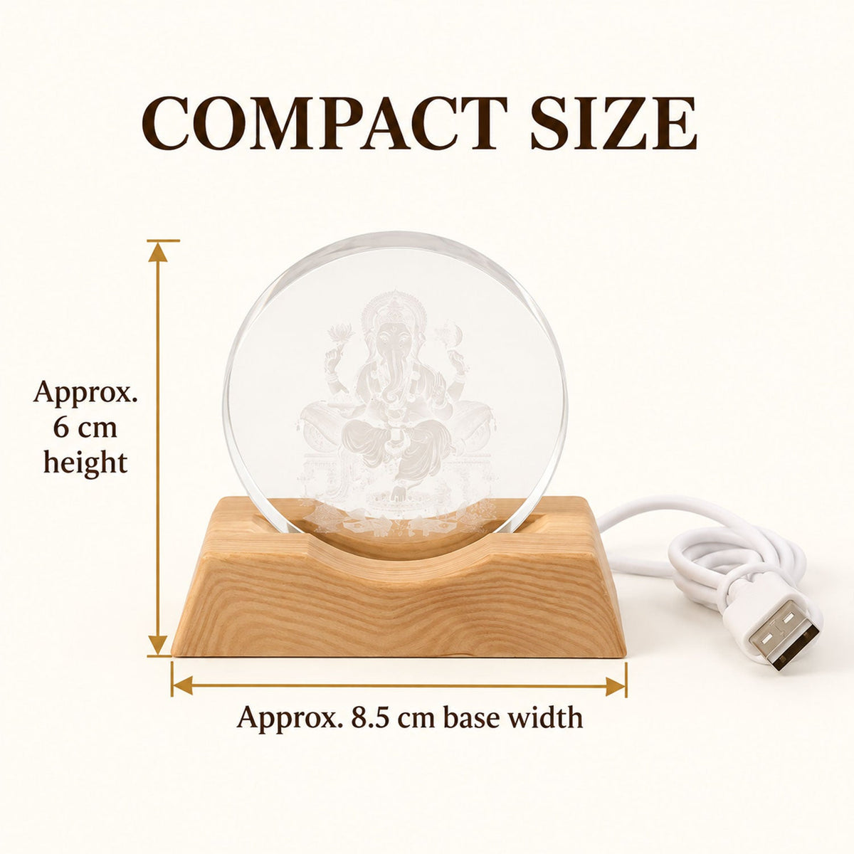 Ganesha LED lamp with a wooden base and USB cable, showing approximate dimensions of 6 cm height and 8.5 cm width.