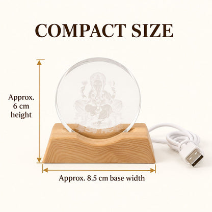 Ganesha LED lamp with a wooden base and USB cable, showing approximate dimensions of 6 cm height and 8.5 cm width.