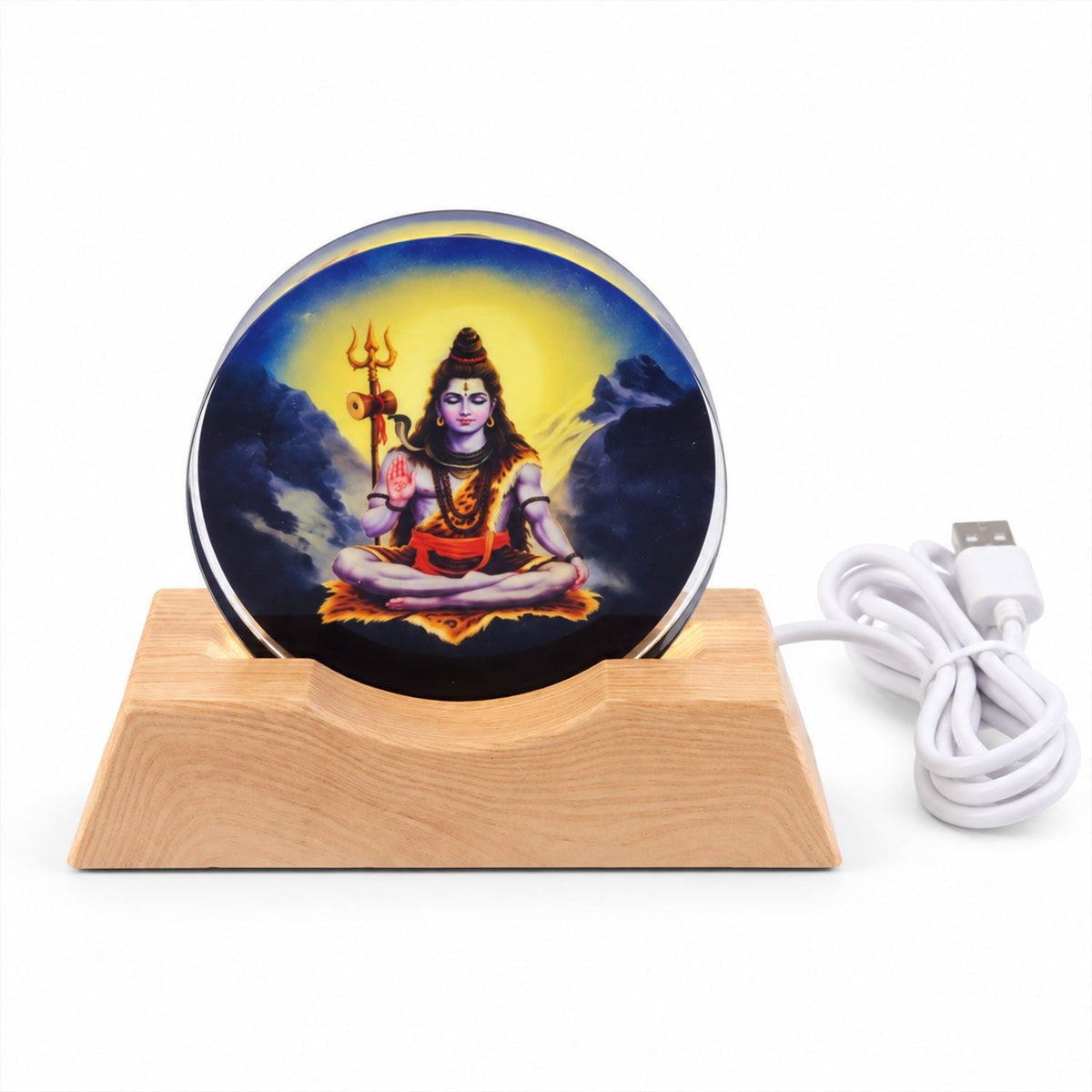Circular acrylic panel depicting Lord Shiva on a light wood base with a white USB cable extending from the back.