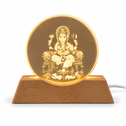 Front view of the Ganesha LED lamp with a wooden base, showcasing the illuminated Ganesha engraving.