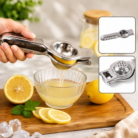 A hand squeezes a lemon in a stainless steel juicer, with juice flowing into a glass bowl.