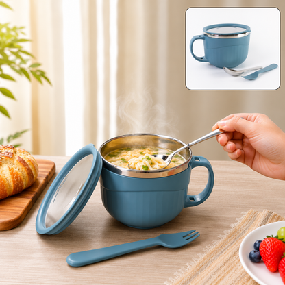 A blue insulated bowl with a lid, containing noodles, with a hand holding a spoon, and a fork on the table.