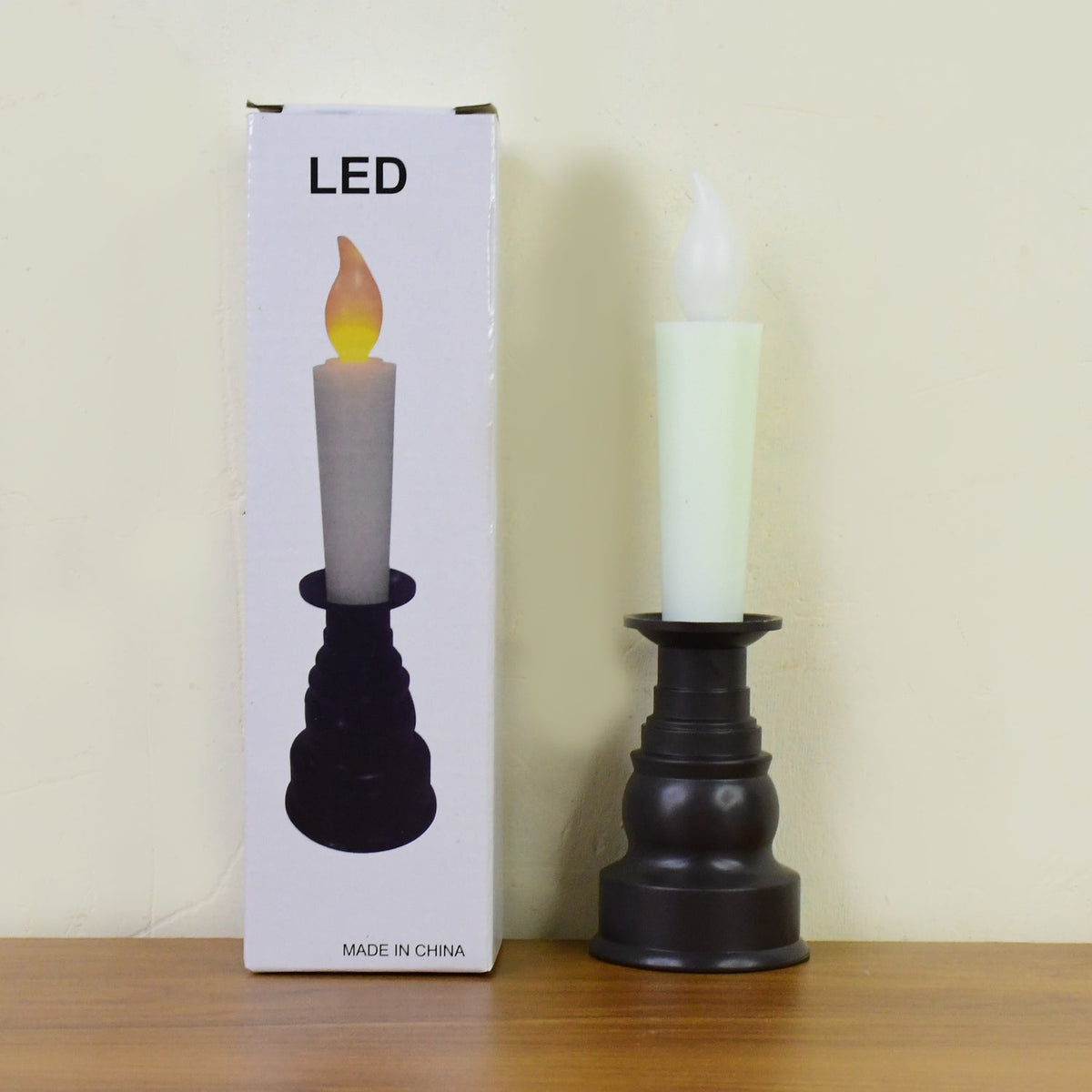 Safe reusable LED flameless candle light with sturdy decorative holder, perfect for long-term use.