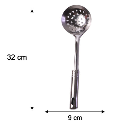 A stainless steel slotted spoon, two solid spoons, a ladle, and a knife with a wooden handle are neatly arranged on a wooden