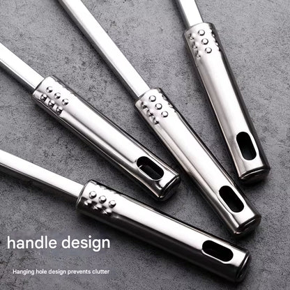 Close up of hanging holes on stainless steel kitchen utensil handles