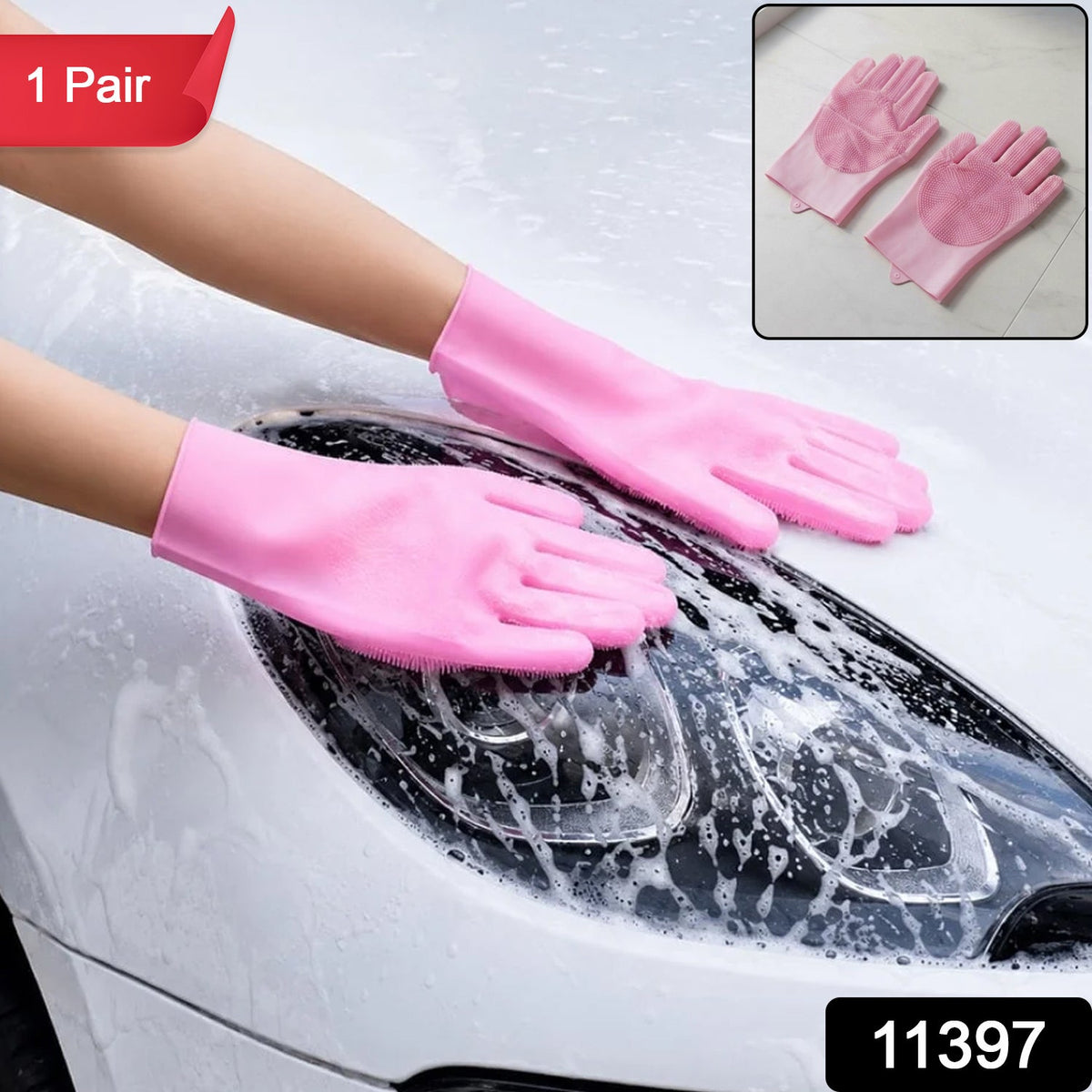 A person wearing pink silicone gloves with scrubbers on the palms and fingers, washing a white car with soap suds. Inset
