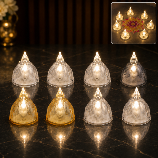 Eight illuminated crystal-style LED diyas, four clear and four amber, arranged on a dark reflective surface.