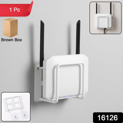 A white WiFi router is mounted to a wall with a white metal bracket, and a brown box is visible in the corner.