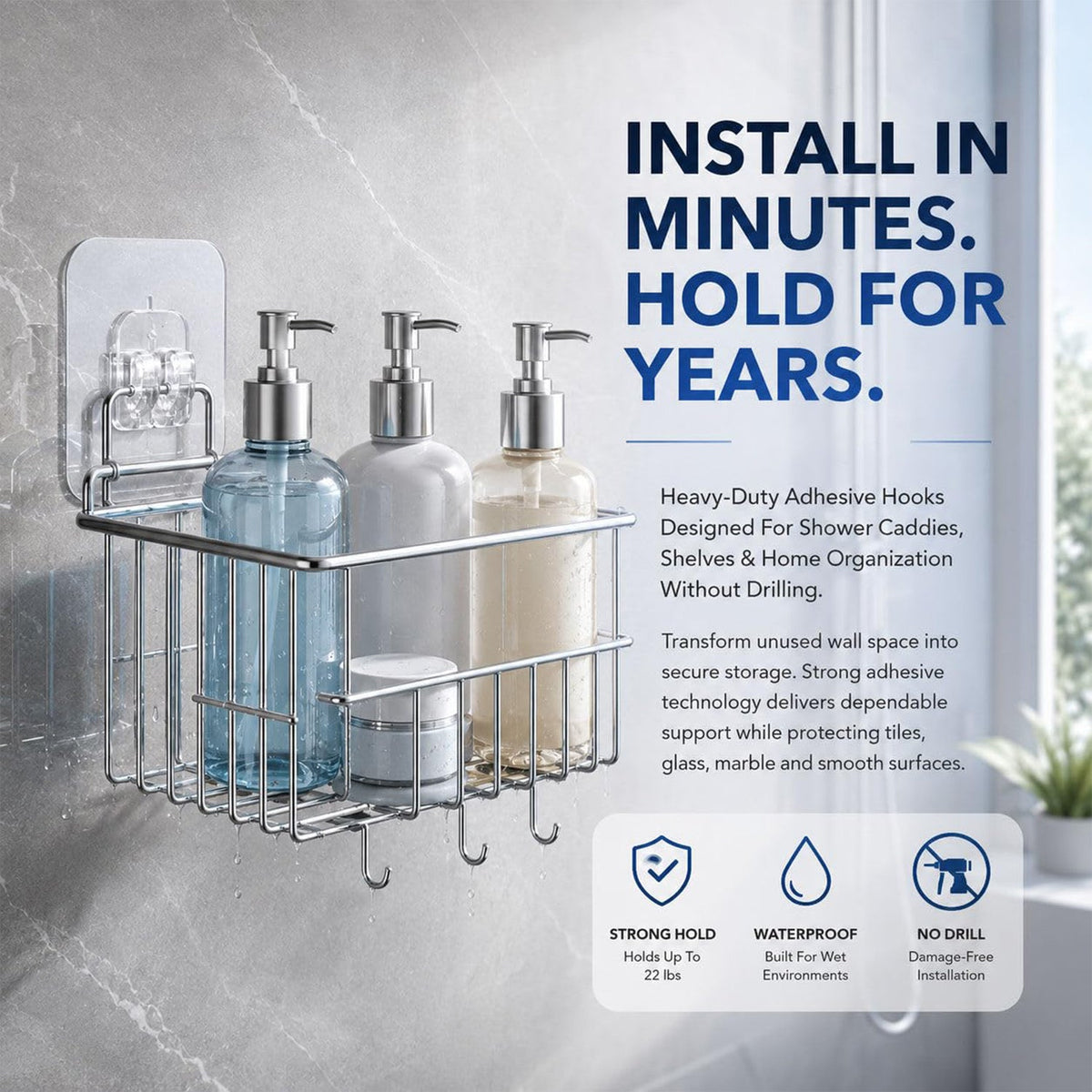 A chrome shower caddy with three bottles and a jar hangs from a clear adhesive hook on a gray tiled wall.