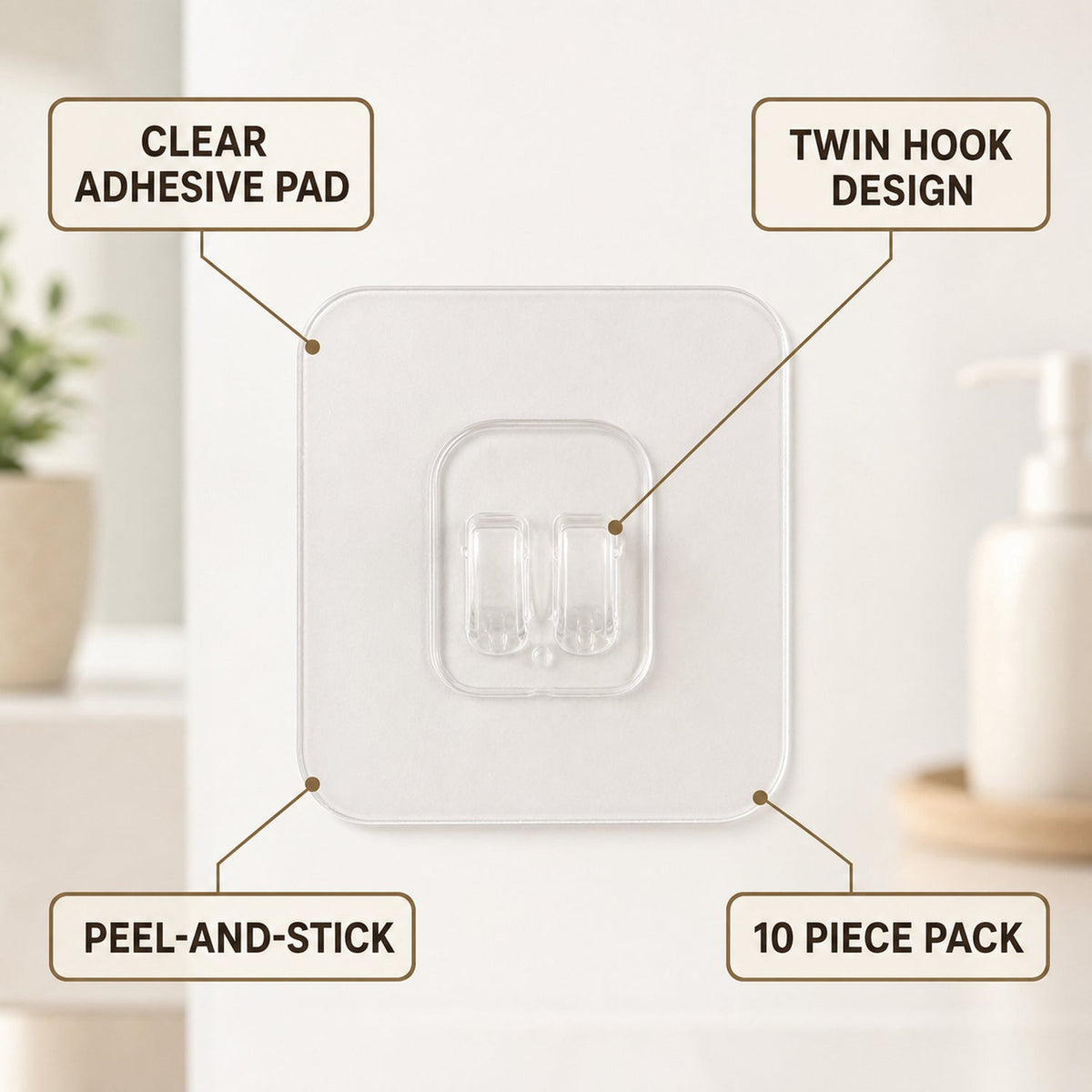 A clear adhesive hook with twin prongs is shown with text labels pointing to its features: clear pad, twin hook,