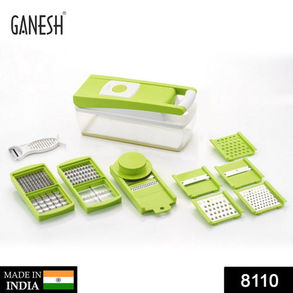 A green and white vegetable dicer with multiple interchangeable blades and a peeler is displayed on a white background.