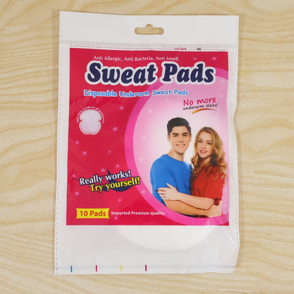 A white and pink plastic package for "Sweat Pads" with images of a man and woman, and text indicating "10 Pads".